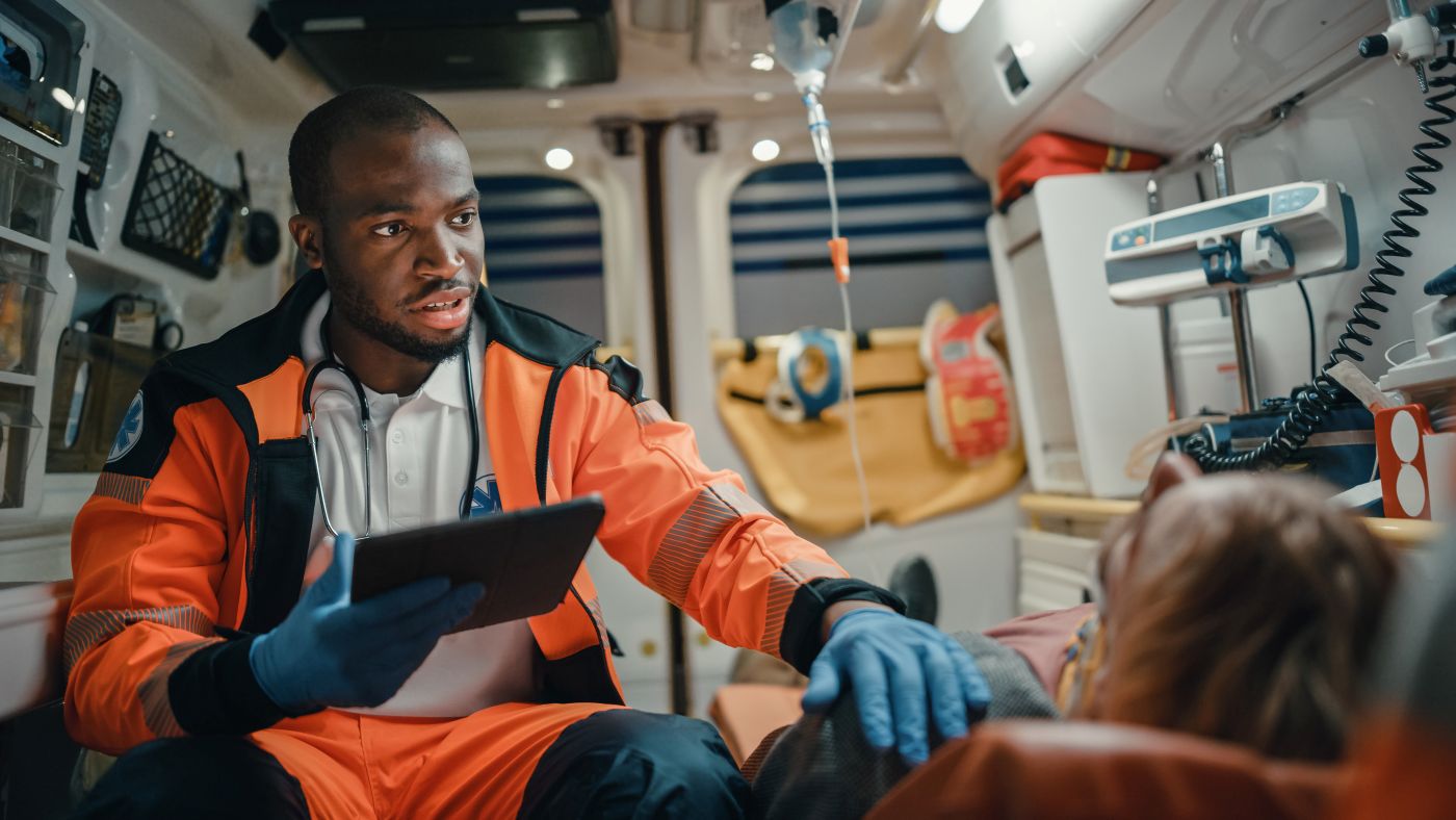 First Responder Tending to Patient in Ambulance